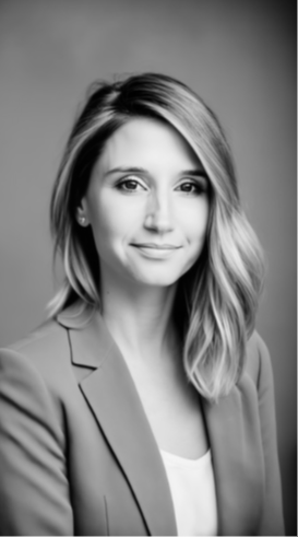 A black and white photo of a woman in a suit.