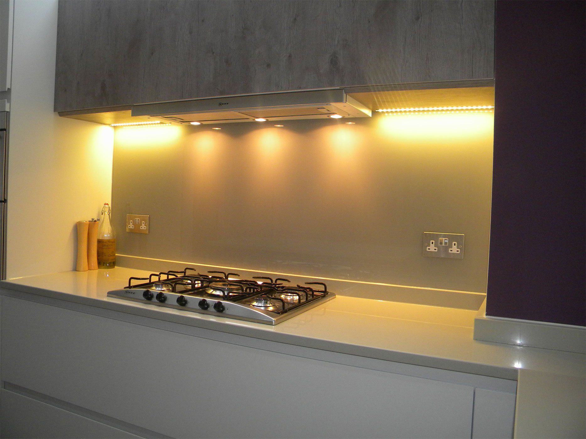 Well lit kitchen hob appliance and counter.