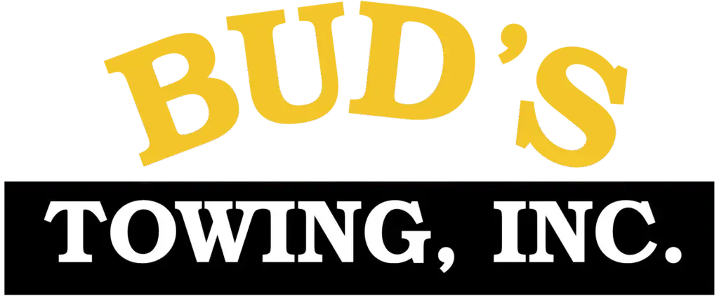 Yellow "BUD'S" logo above "TOWING, INC." in white letters on a black rectangle.