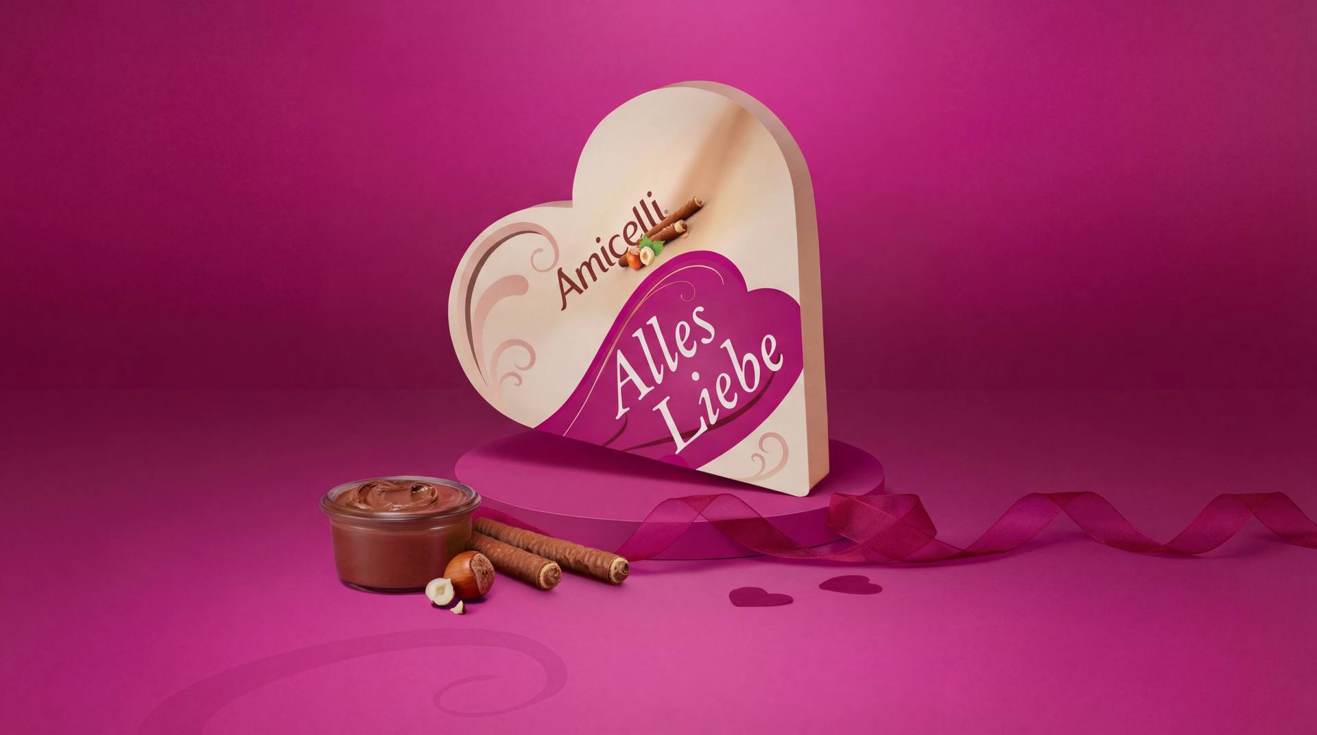 Amicelli-Kakaocremewaffelröllchen und Kakaocreme auf rosa Hintergrund.