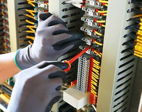 Electrician Repairing Electric Panel — San Diego, CA — Swinson Electric