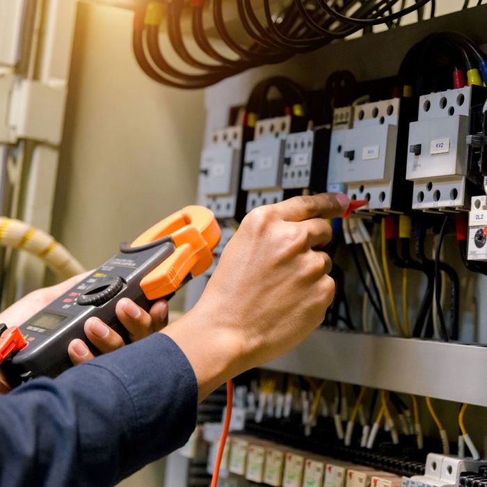Electrician Checking Electric Voltage — San Diego, CA — Swinson Electric