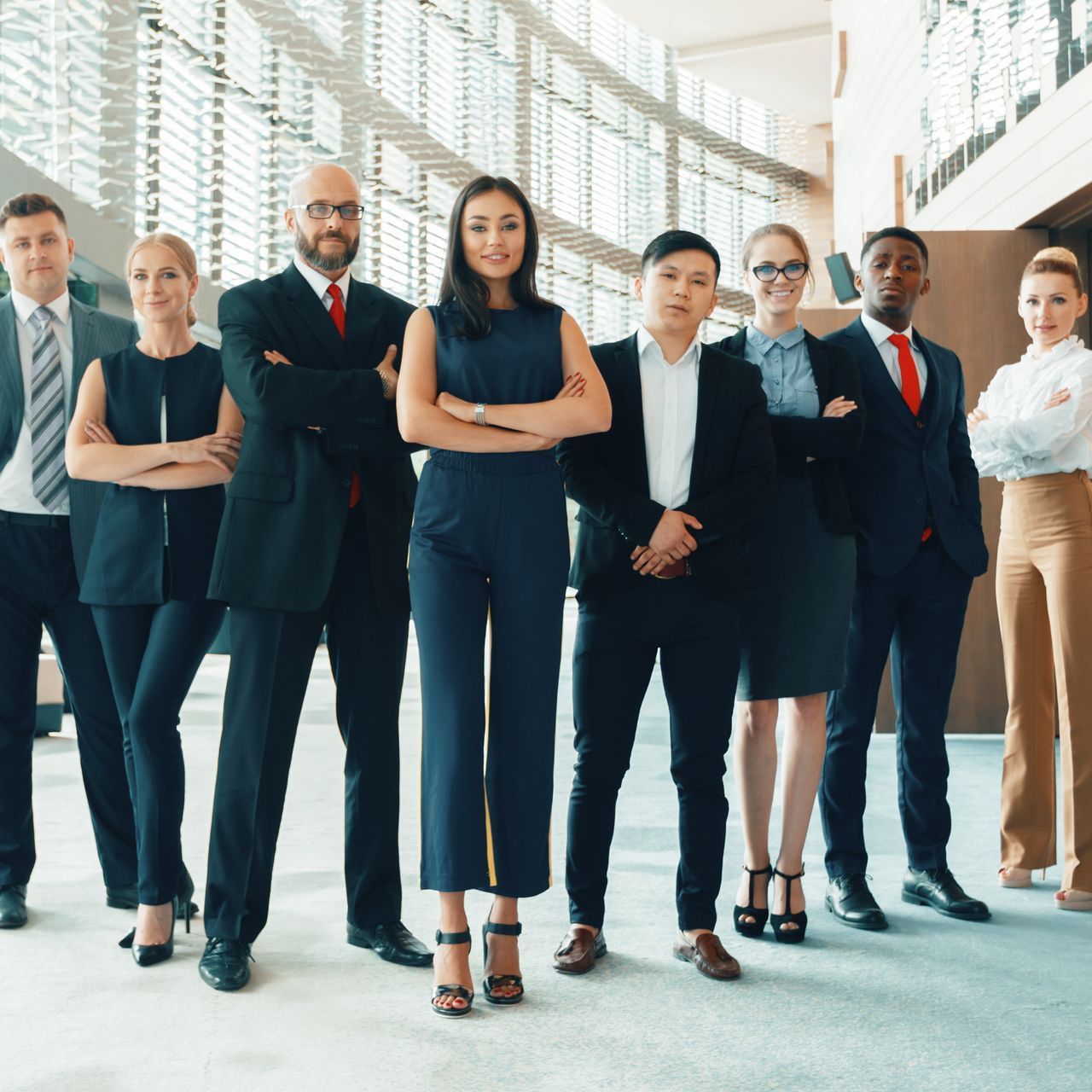 A group of business people are posing for a picture together