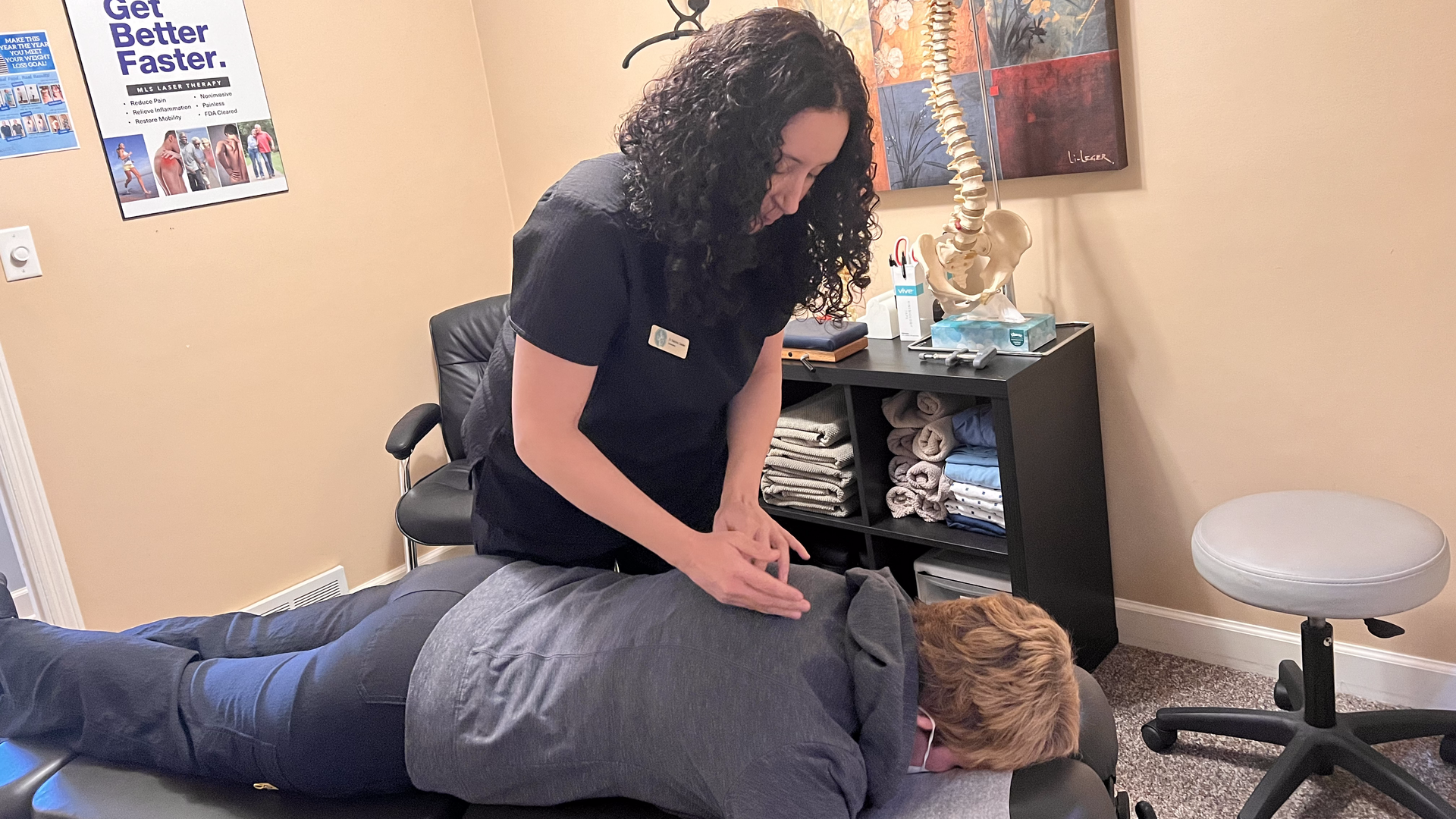 Chiropractic Adjustment of a shoulder and back by Dr. Sabrina