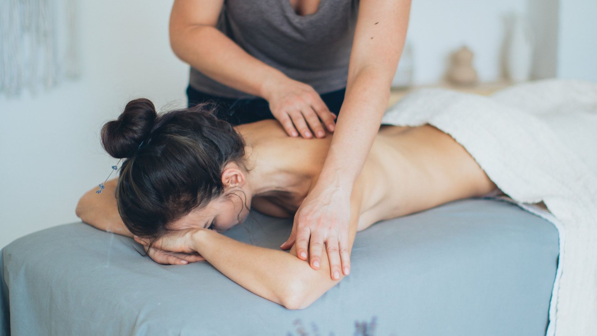 A woman receiving a massage for therapy