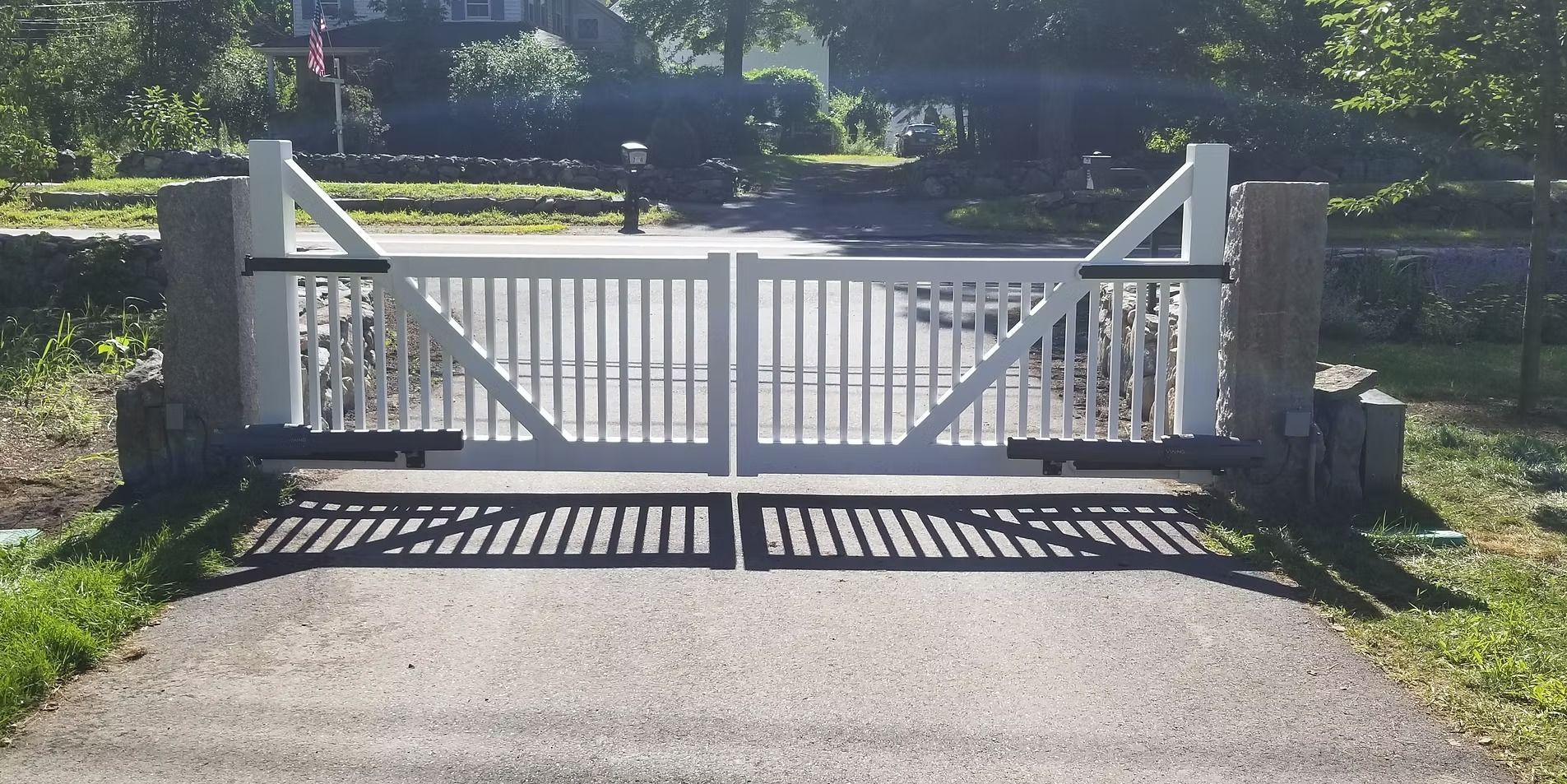 A small orange excavator is digging a hole in front of a house.