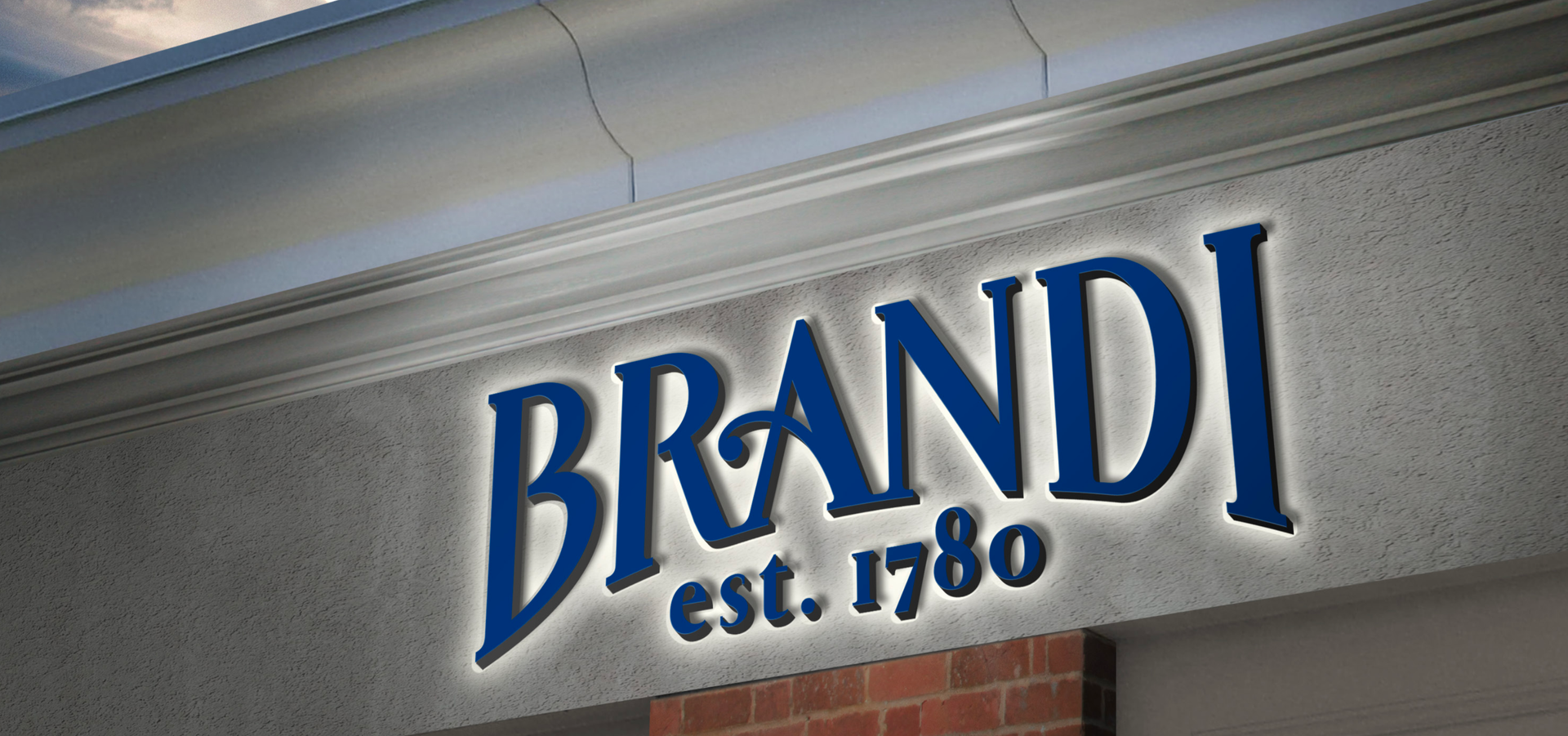 Sign for Brani, established 1780, with blue lettering on a gray building.
