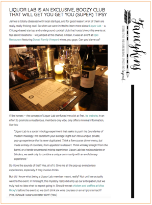 Article about Liquor Lab, a boozy club, with a photo of a bar table with a wine bottle, glasses, and a menu.