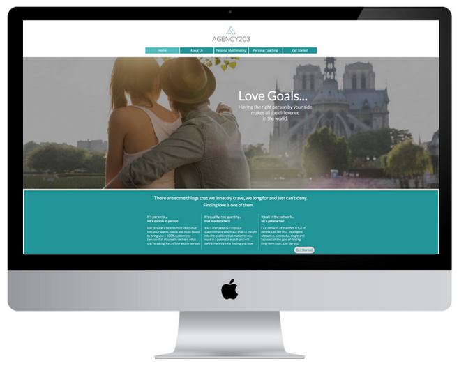 Agency website on a computer screen. Couple embracing in Paris with the Eiffel Tower in background.