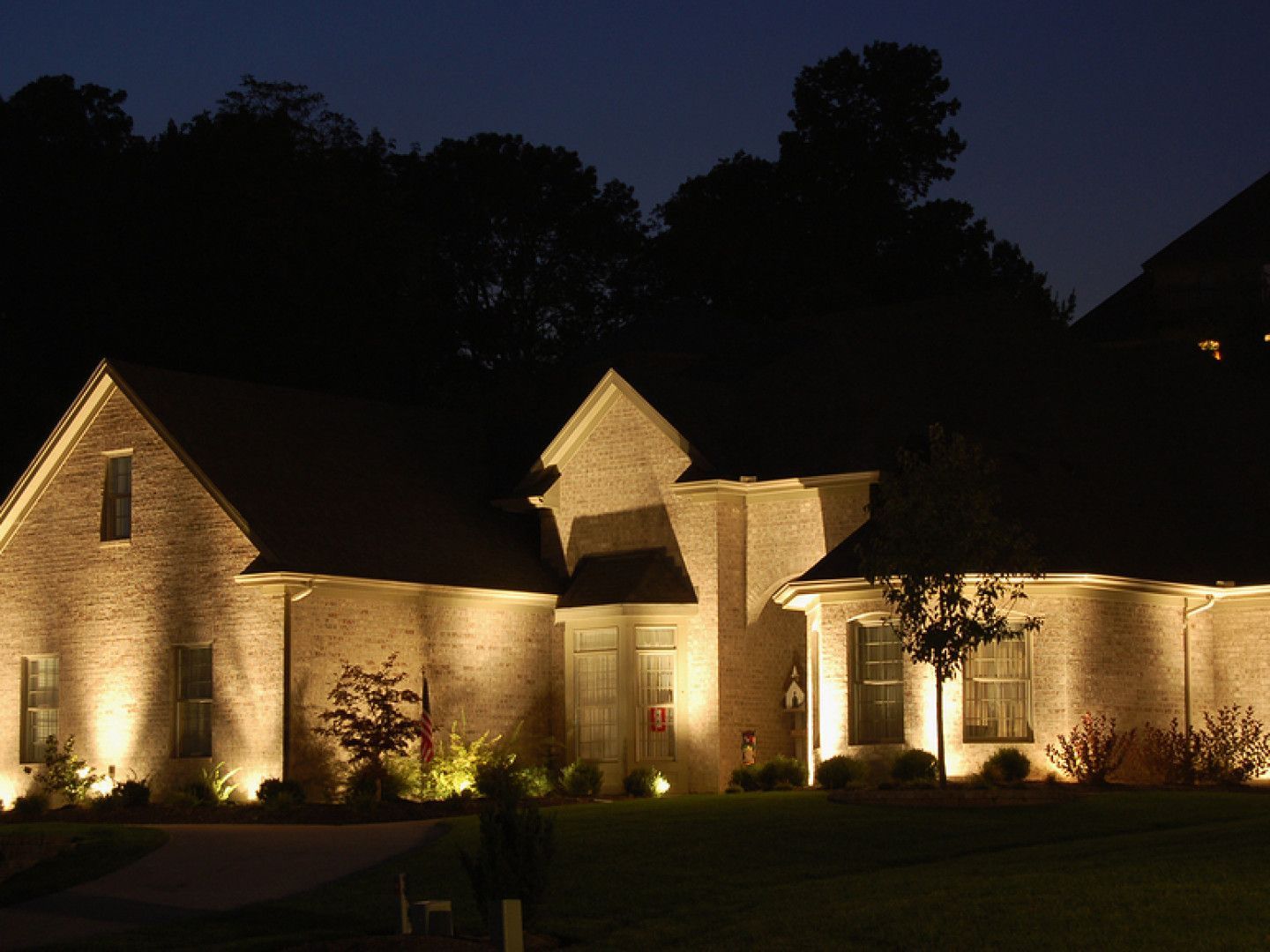 Large Brick House Is Lit up At Night