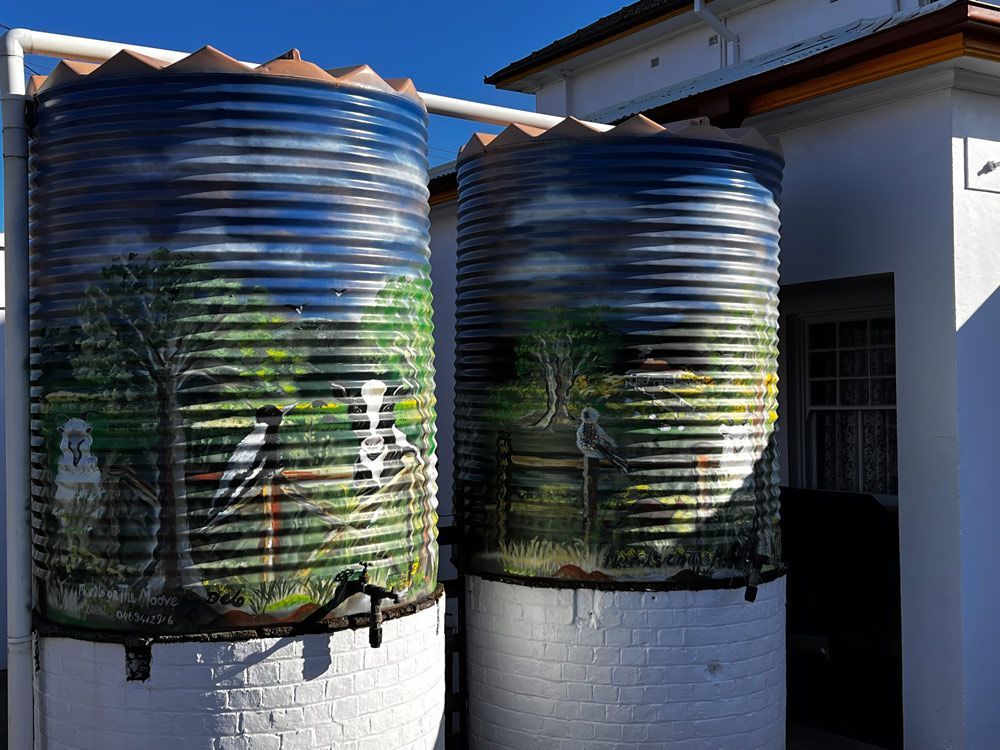 Two Tanks Outside With Bird Paintings — Merriwa Motor Inn & Motel In Merriwa NSW
