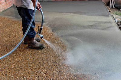 Worker Washing Exposed Aggregate Concrete — Lincoln Park, MI — Dix Block and Supply Company Inc.