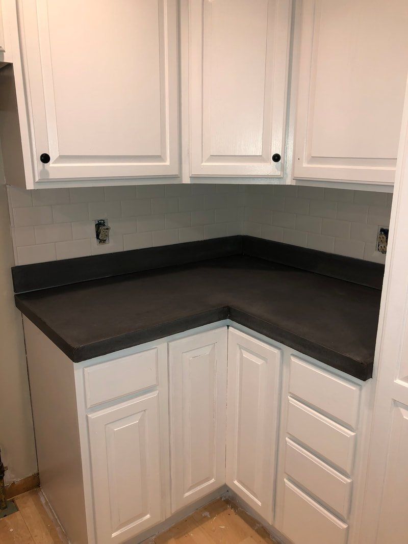 Concrete Countertop with White Kitchen Cabinets — Lincoln Park, MI — Dix Block and Supply Company Inc.