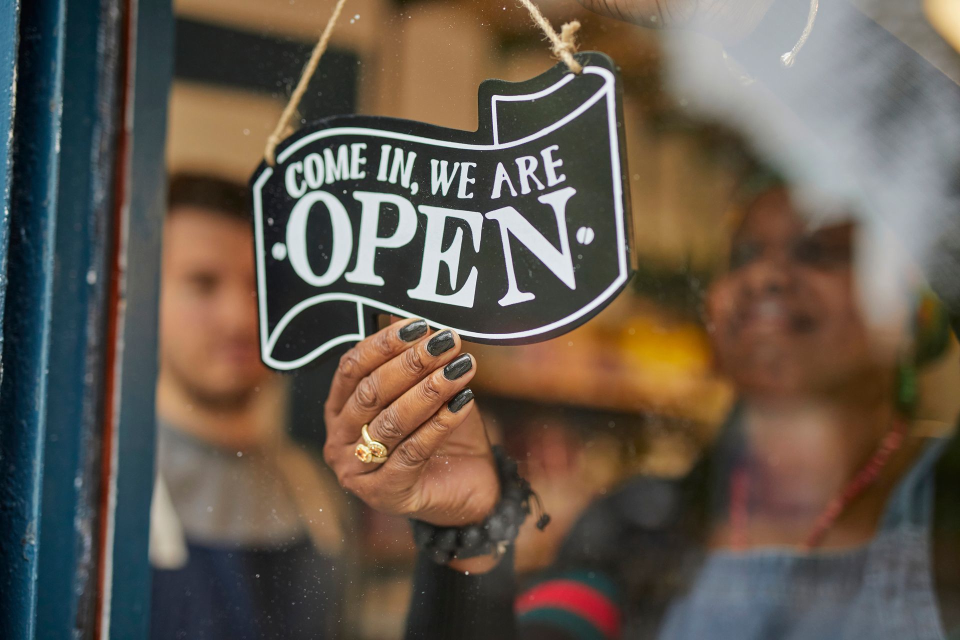 A pen rests on top of a blue insurance policy