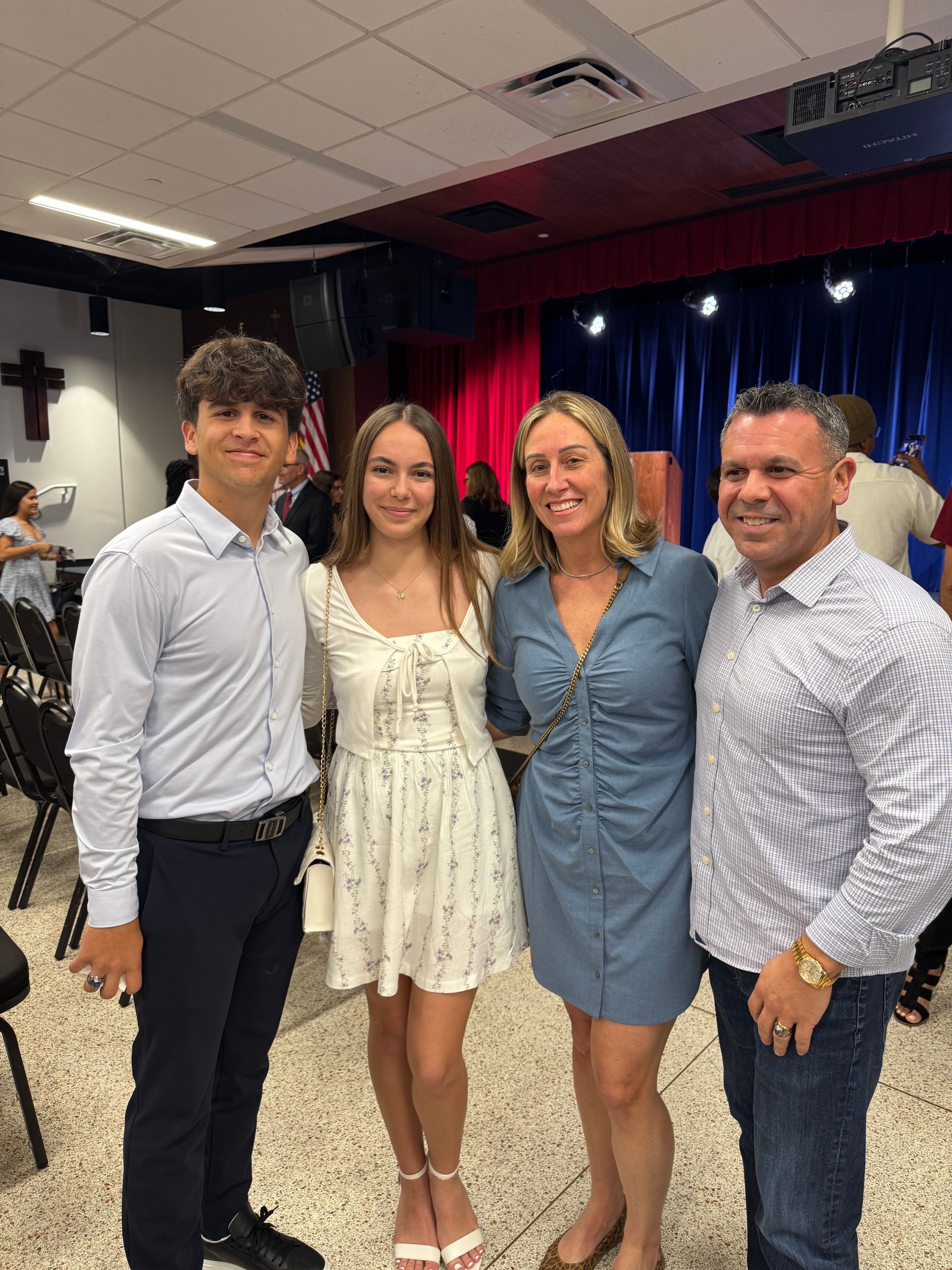 A video camera is recording a concert in an auditorium.