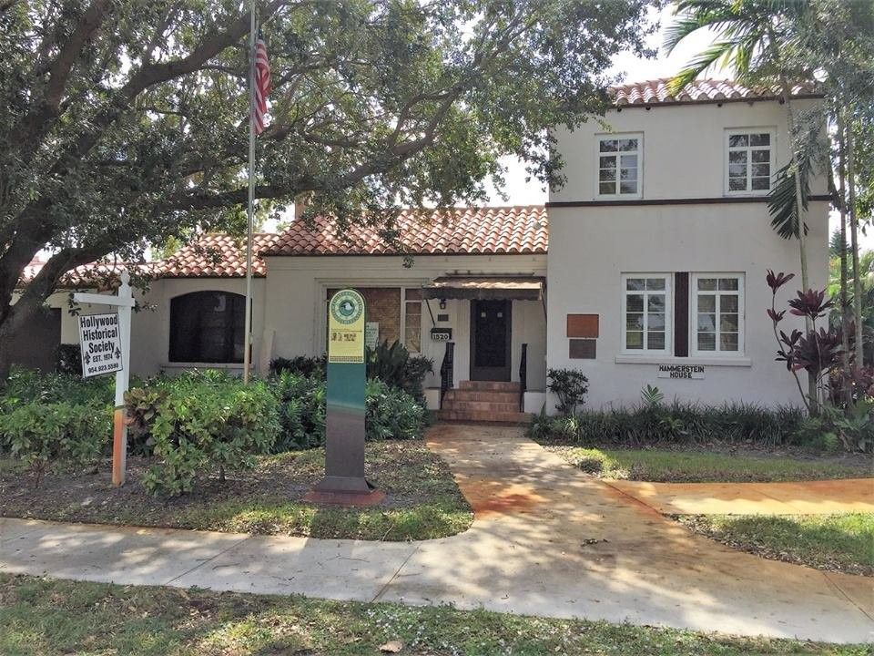 A judge 's gavel is sitting on top of a stack of money next to a calculator.