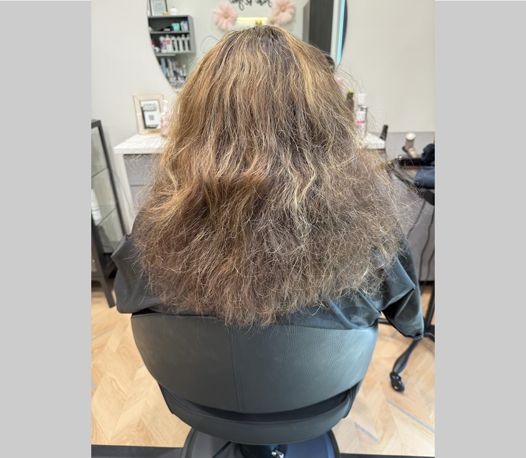 Long frizzy black hair. It is very thick and fluffy.