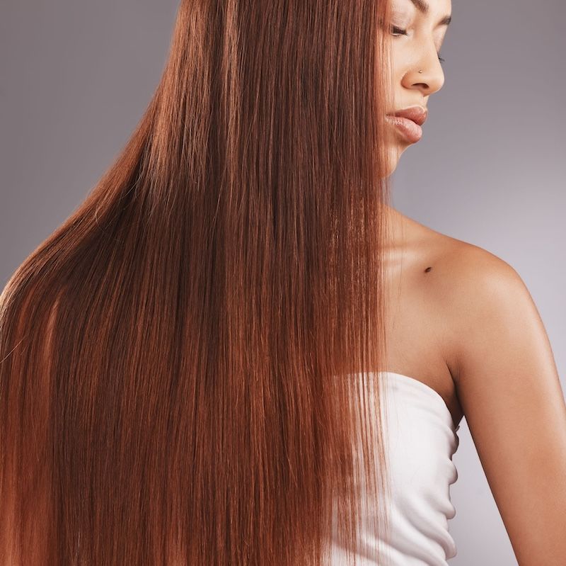 African American woman with long smooth hair.