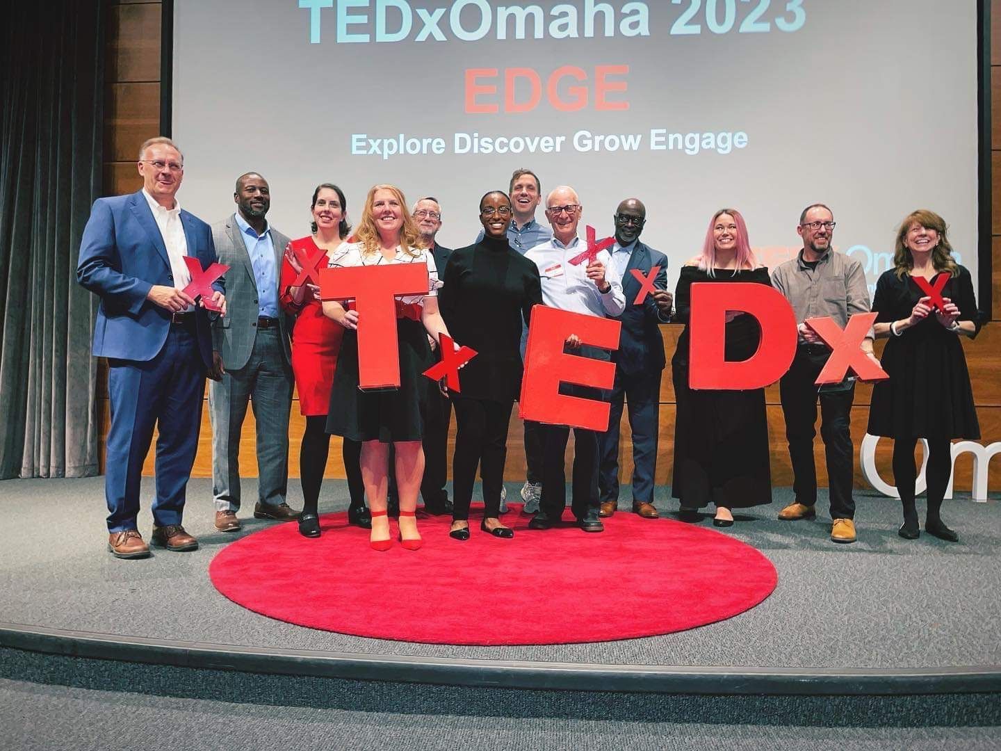 TEDx Omaha 2023 speakers smiling on stage