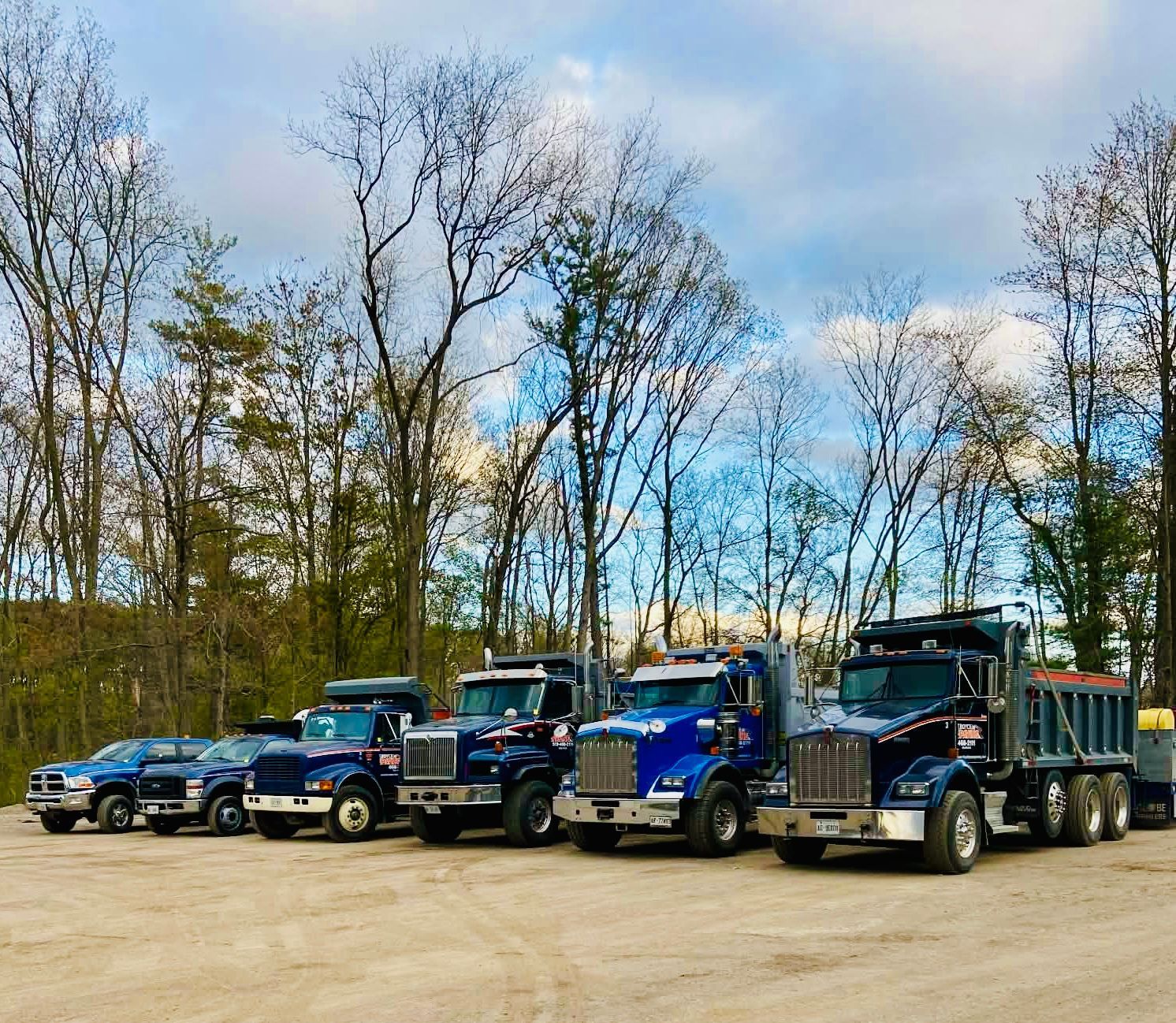 A square image featuring a light-gray placeholder icon of a sun over two hills against a light-gray background.