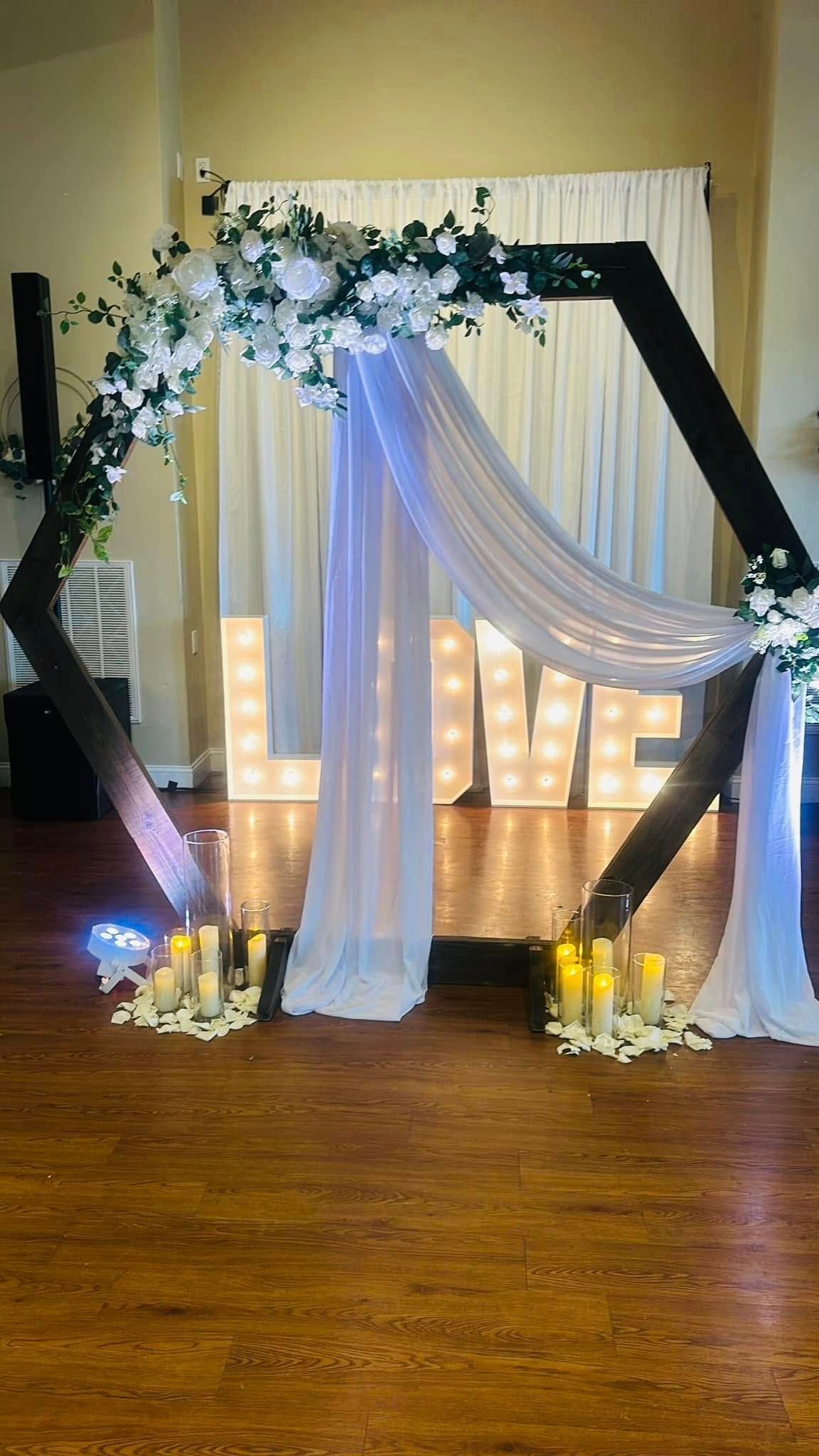 There is a large sign that says `` love '' in the middle of the room.
