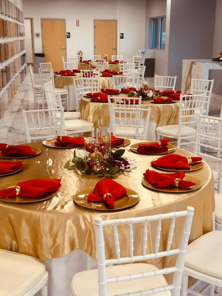 A room filled with tables and chairs set up for a party.