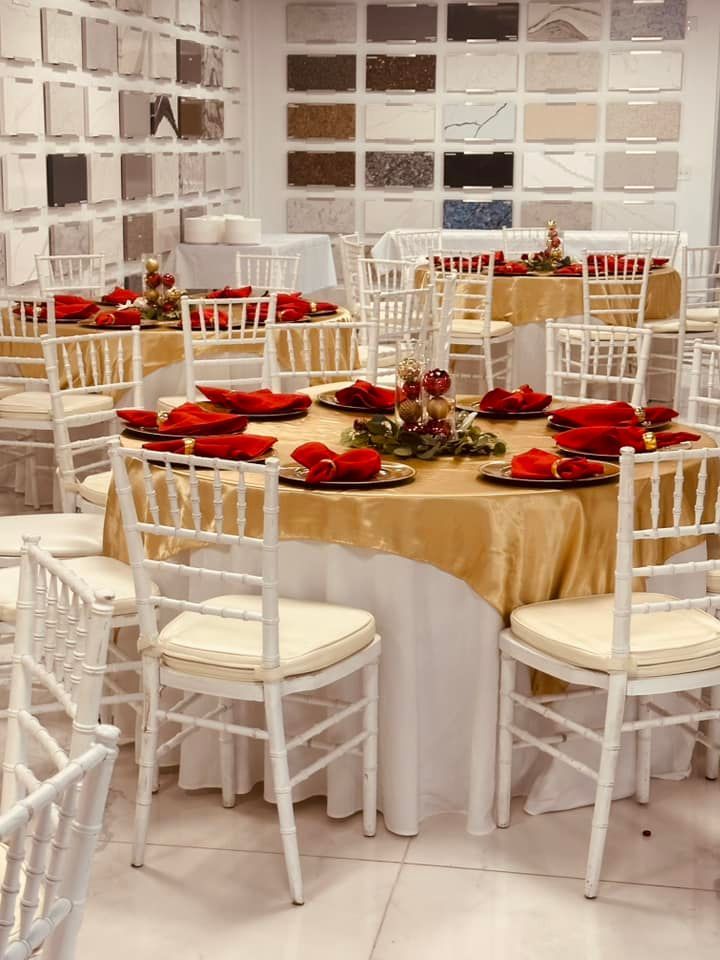 A room with tables and chairs set up for a party