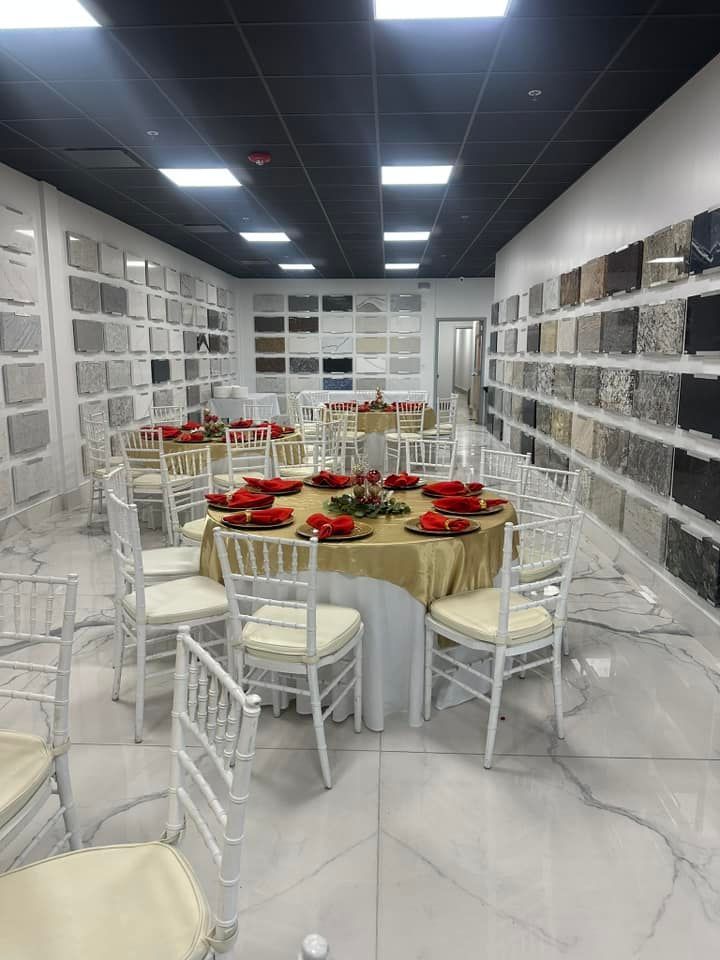 A room filled with tables and chairs set up for a party.