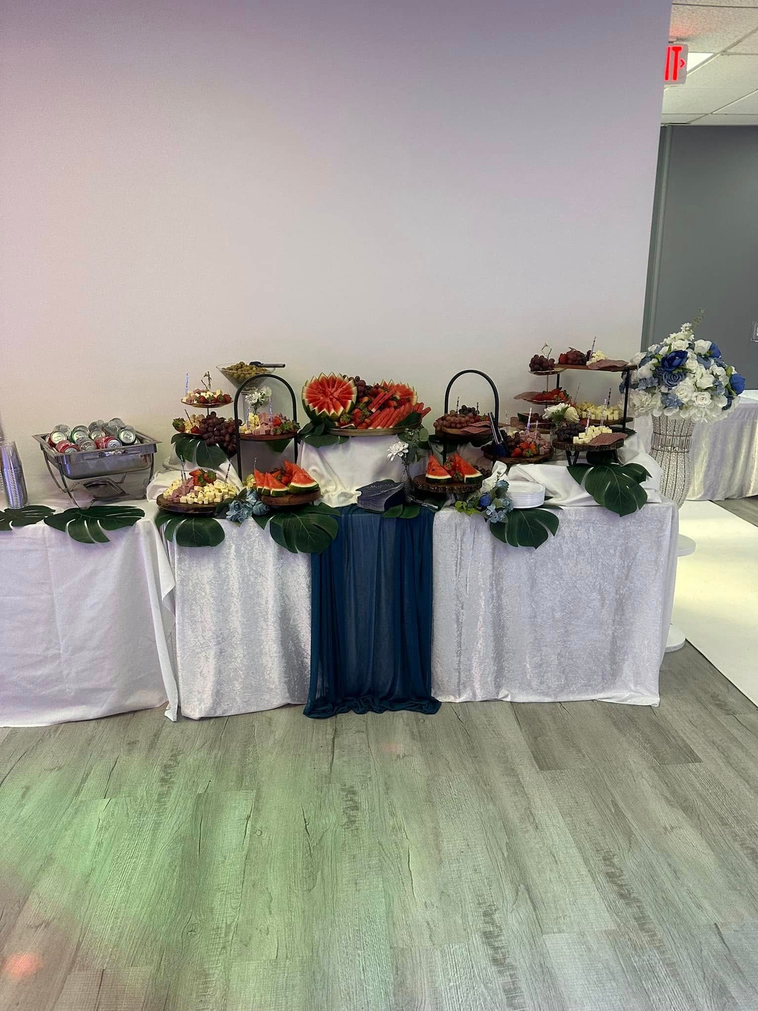 A buffet table with a lot of food on it in a room.