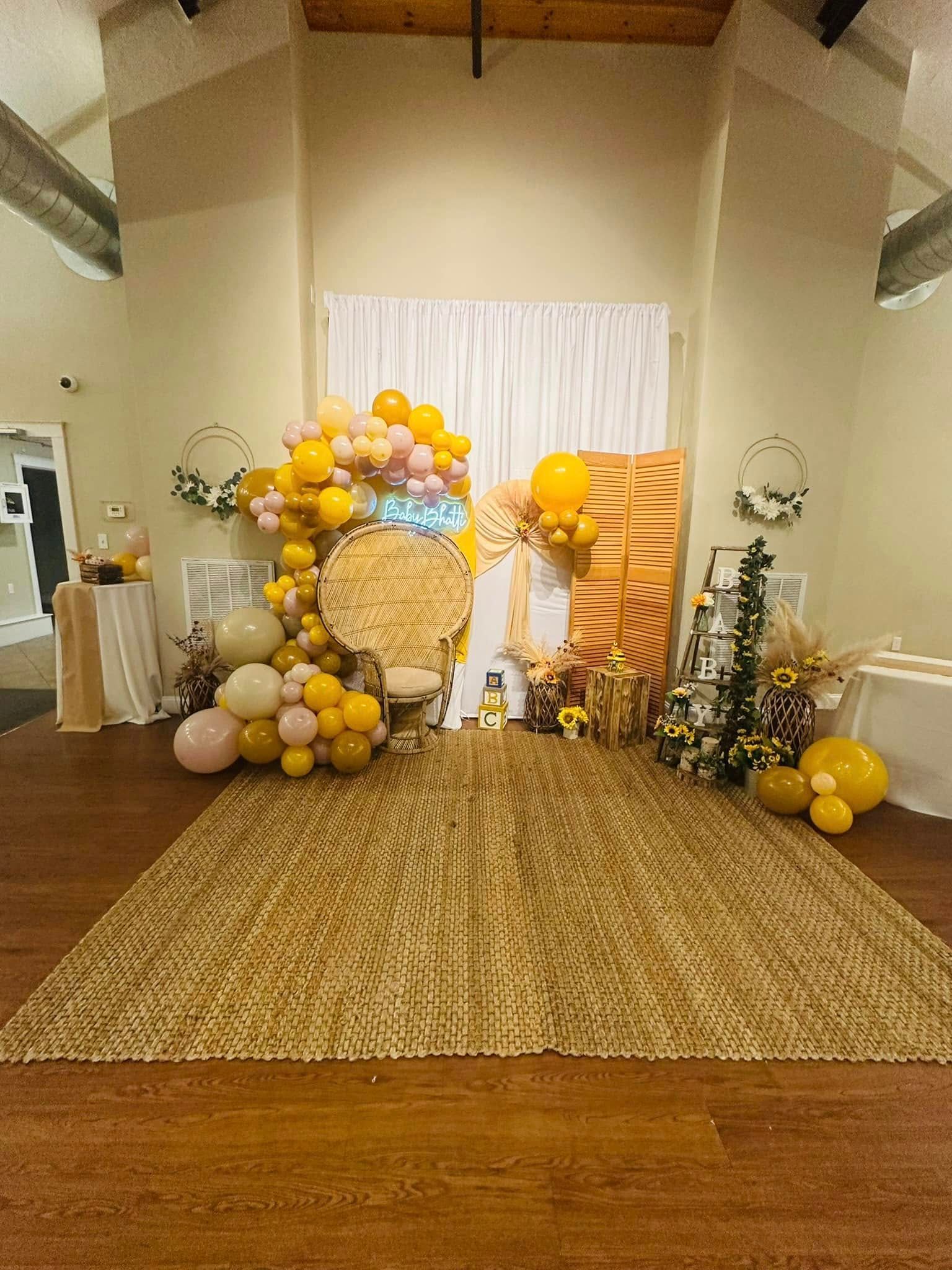 A room filled with balloons and a chair.