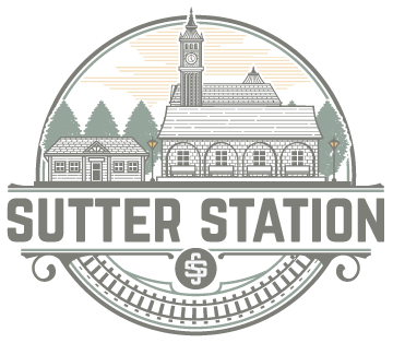 Sutter Station logo with historic green train station and clock tower in an oval emblem