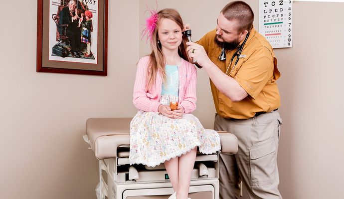 Dotor Check the Ears of the Young Girl — Paragould, AR — Paragould Family Care