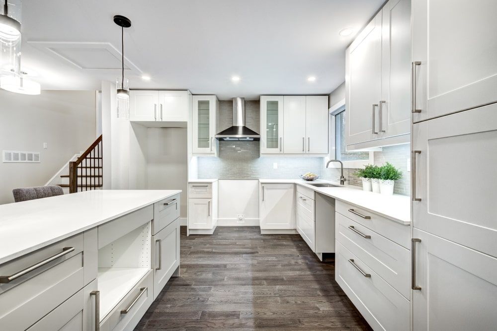 Kitchen With White Cabinets And Stainless Steel Appliances — R3 Construction In Queanbeyan, NSW