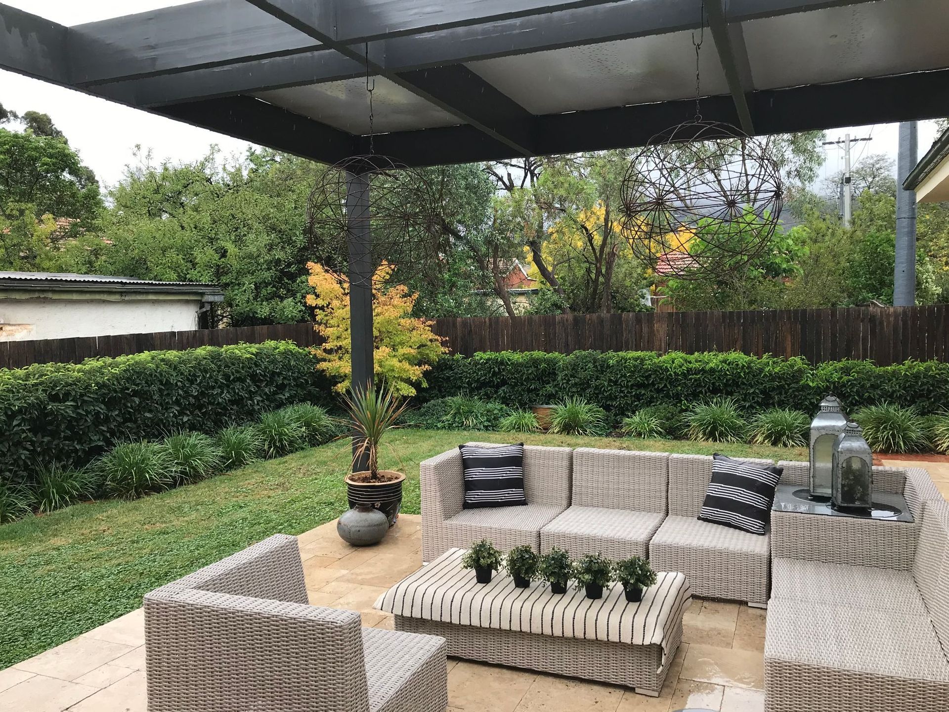 Man Is Working On A Wooden Structure On A Patio Deck — R3 Construction In O'Connor, ACT