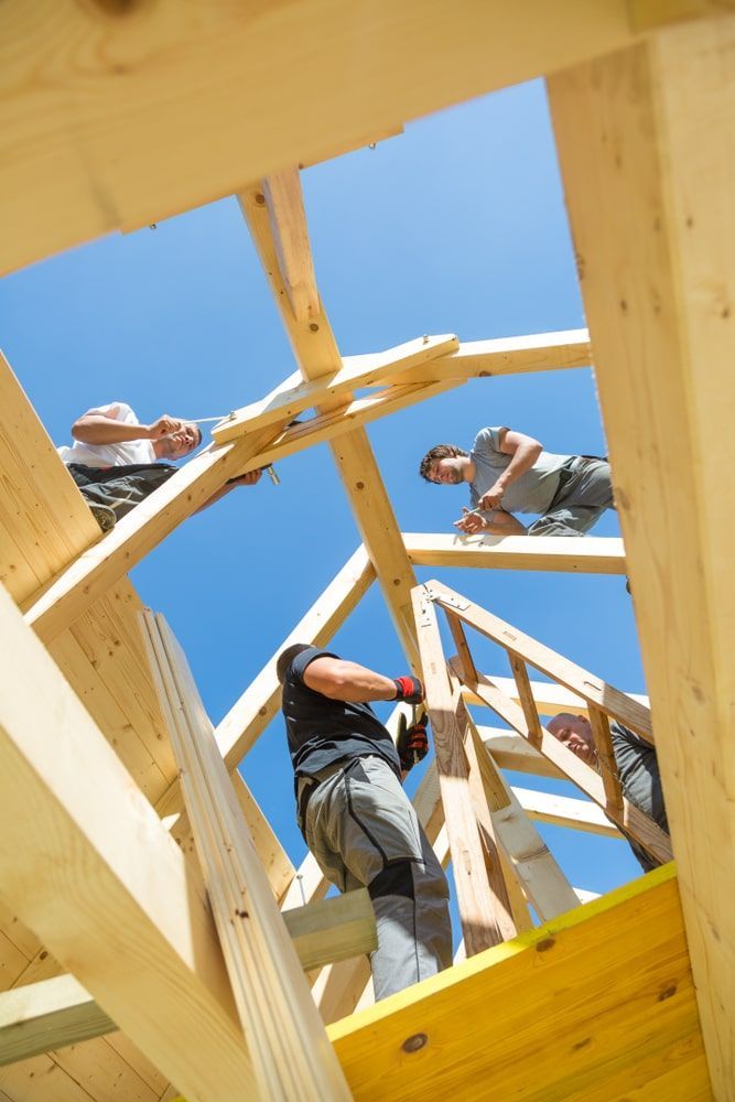 Group Of Builders Working On A Wooden Structure — R3 Construction In O'Connor, ACT