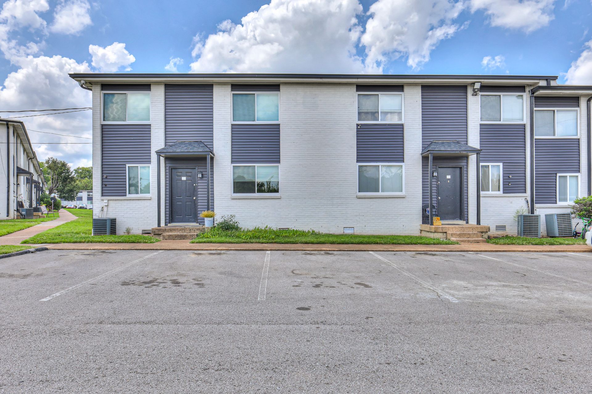 Photo of a building, showing the parking spaces in front