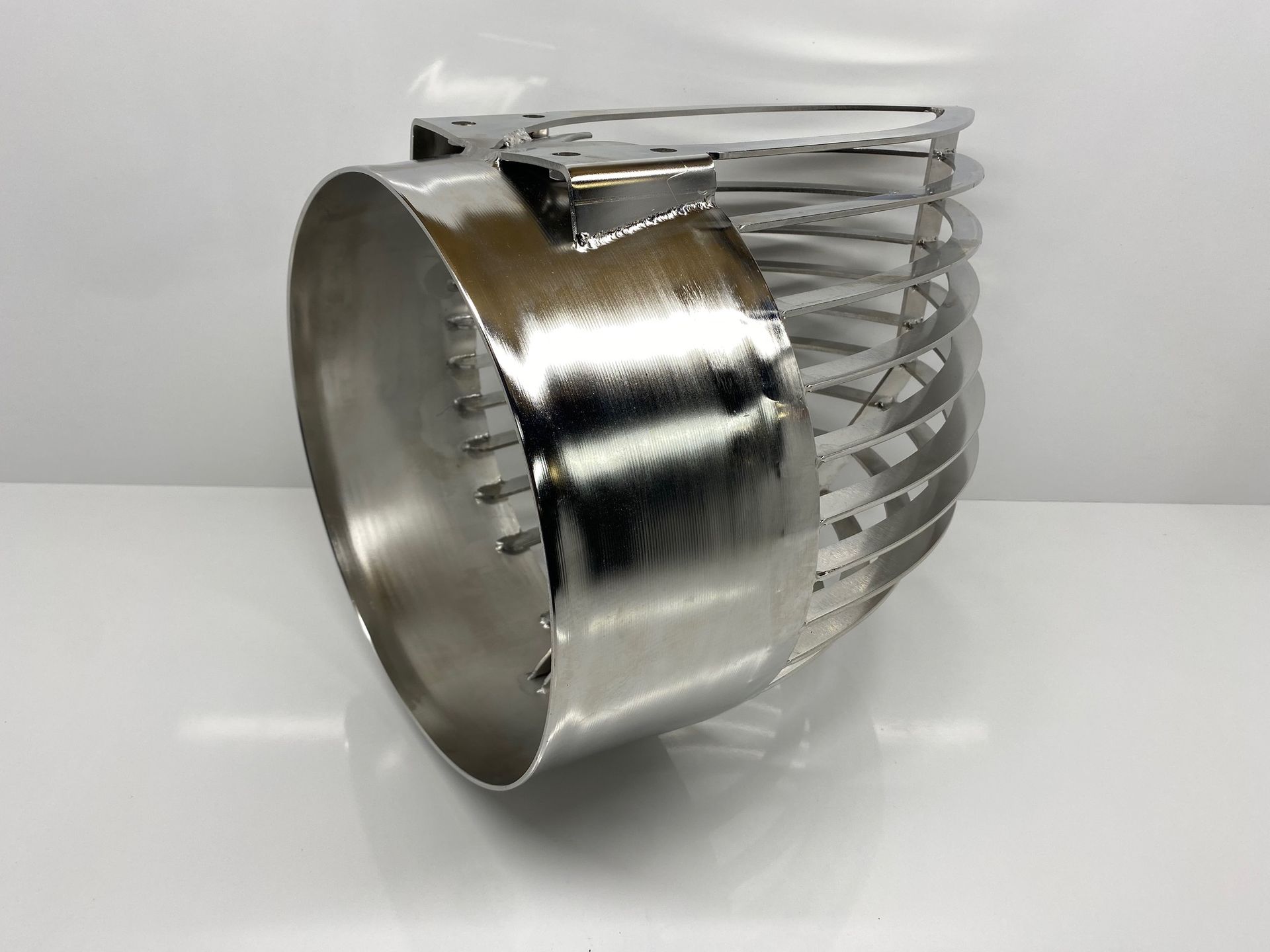 Close-up of a steel propeller guard protecting a boat motor, ensuring safety and durability.