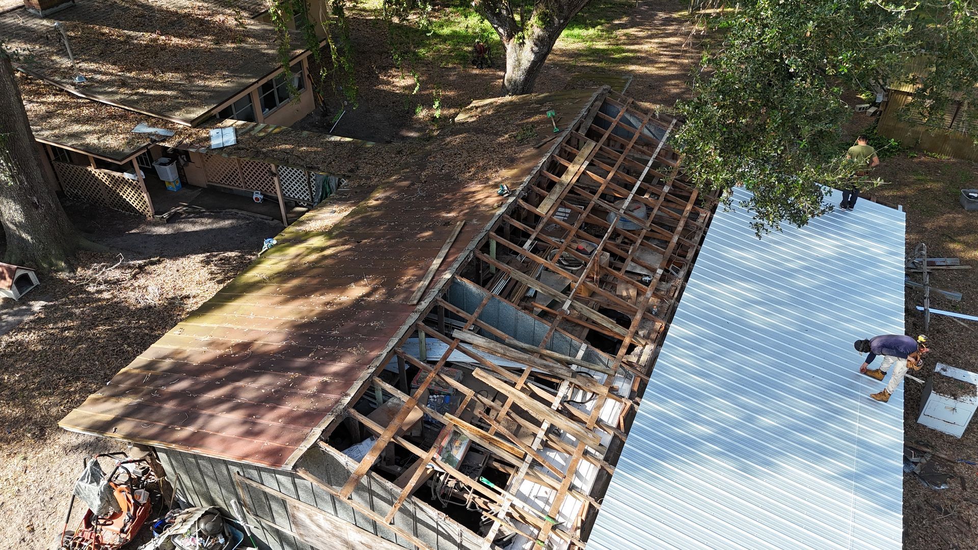 An aerial view of a house that is being demolished.