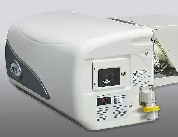The back of a white machine with a yellow ring on it