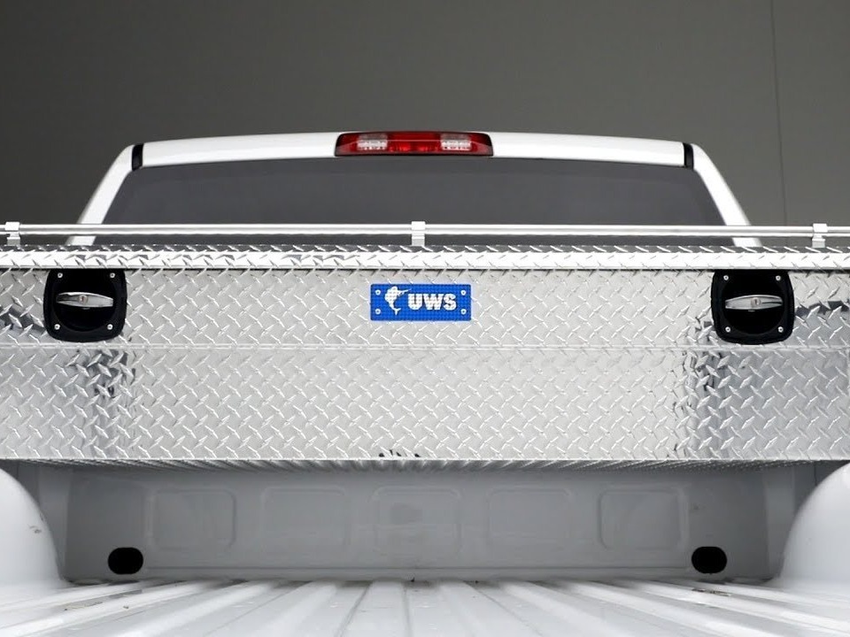 a silver truck with a blue label that says ews