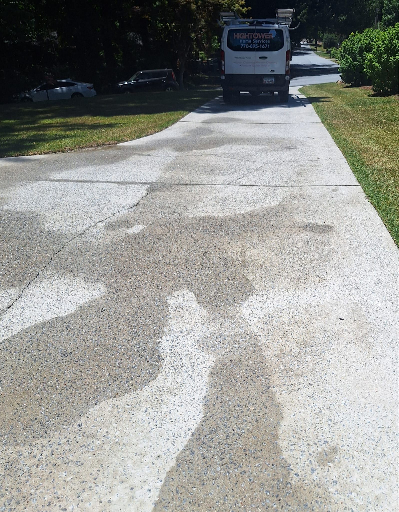 A white truck is parked on the side of the road
