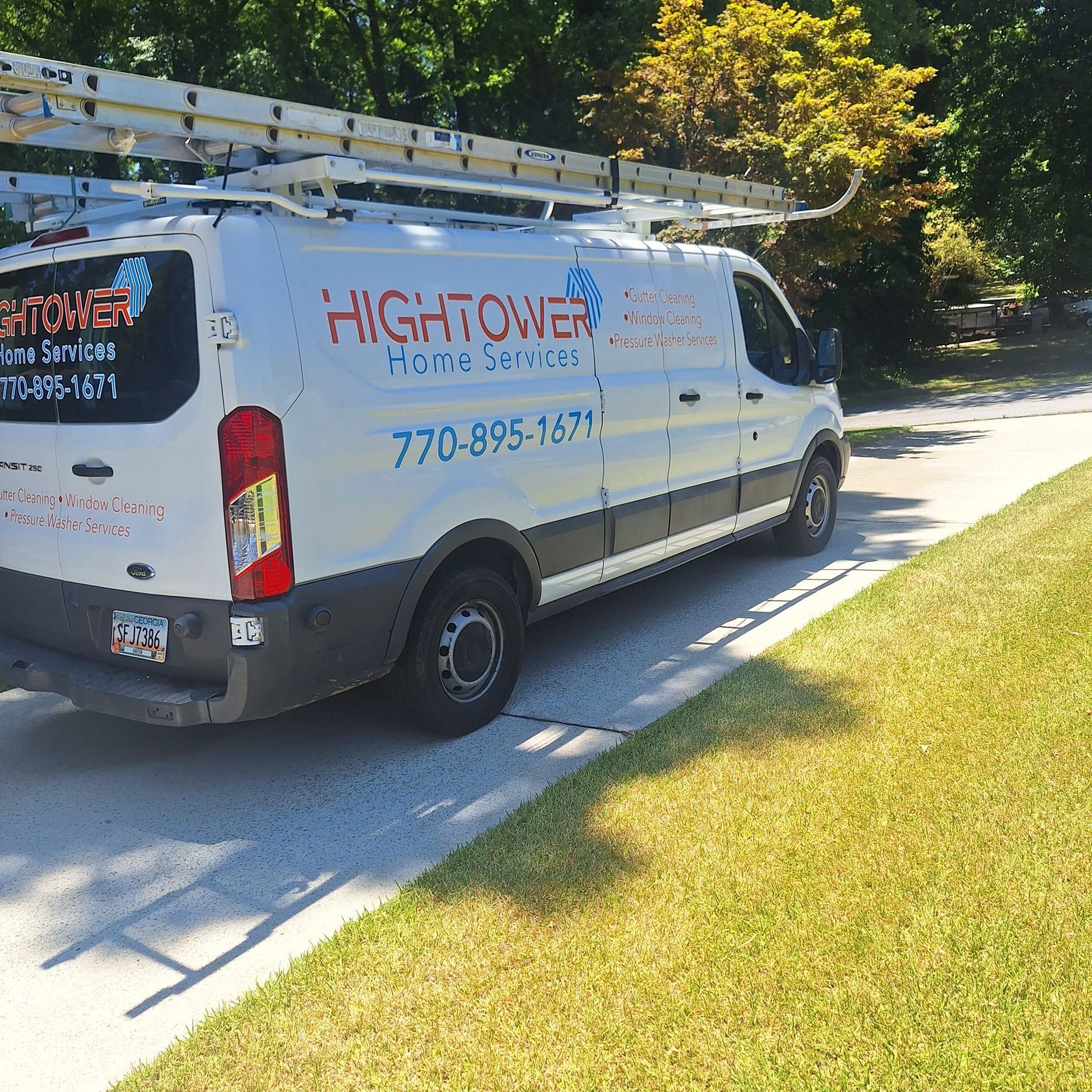 A hightower van is parked on the side of the road