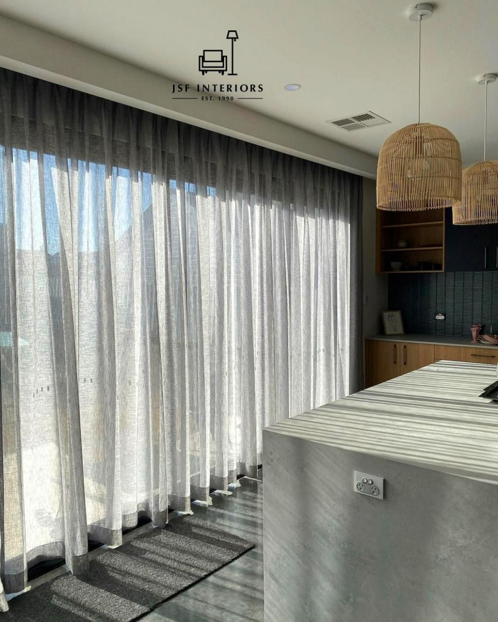 Sheer Gray Curtains In Front Of Glass Doors — JSF Interiors Goulburn in Dapto, NSW