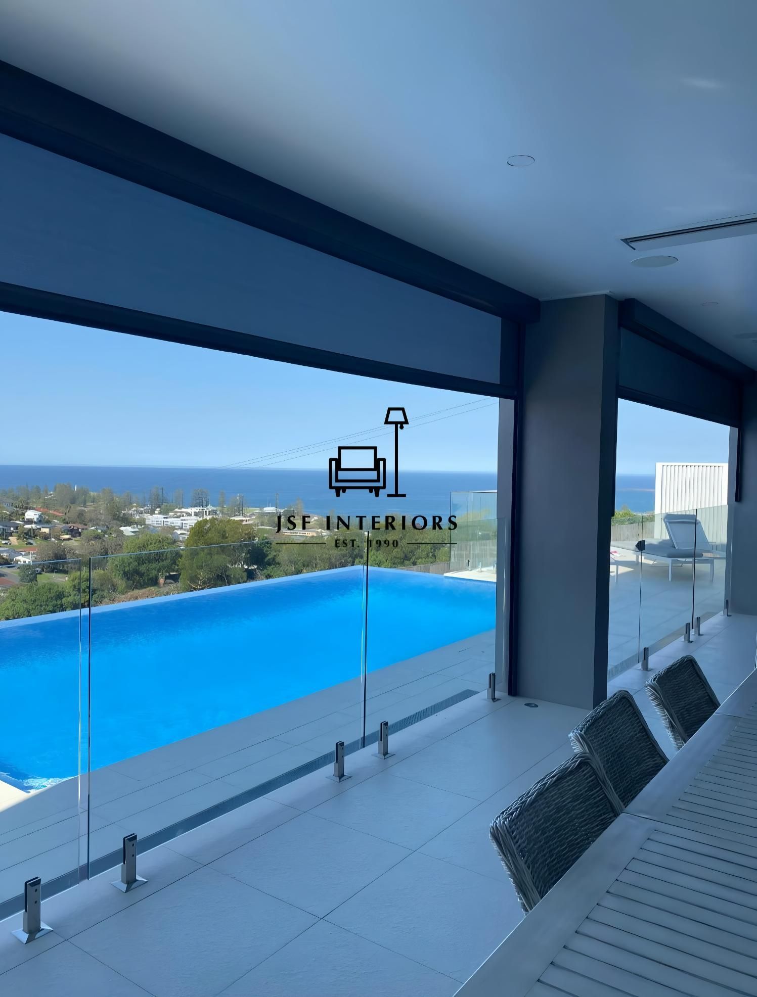 Poolside Dining Area With Ocean View And Glass Railing — JSF Interiors Goulburn in Goulburn, NSW