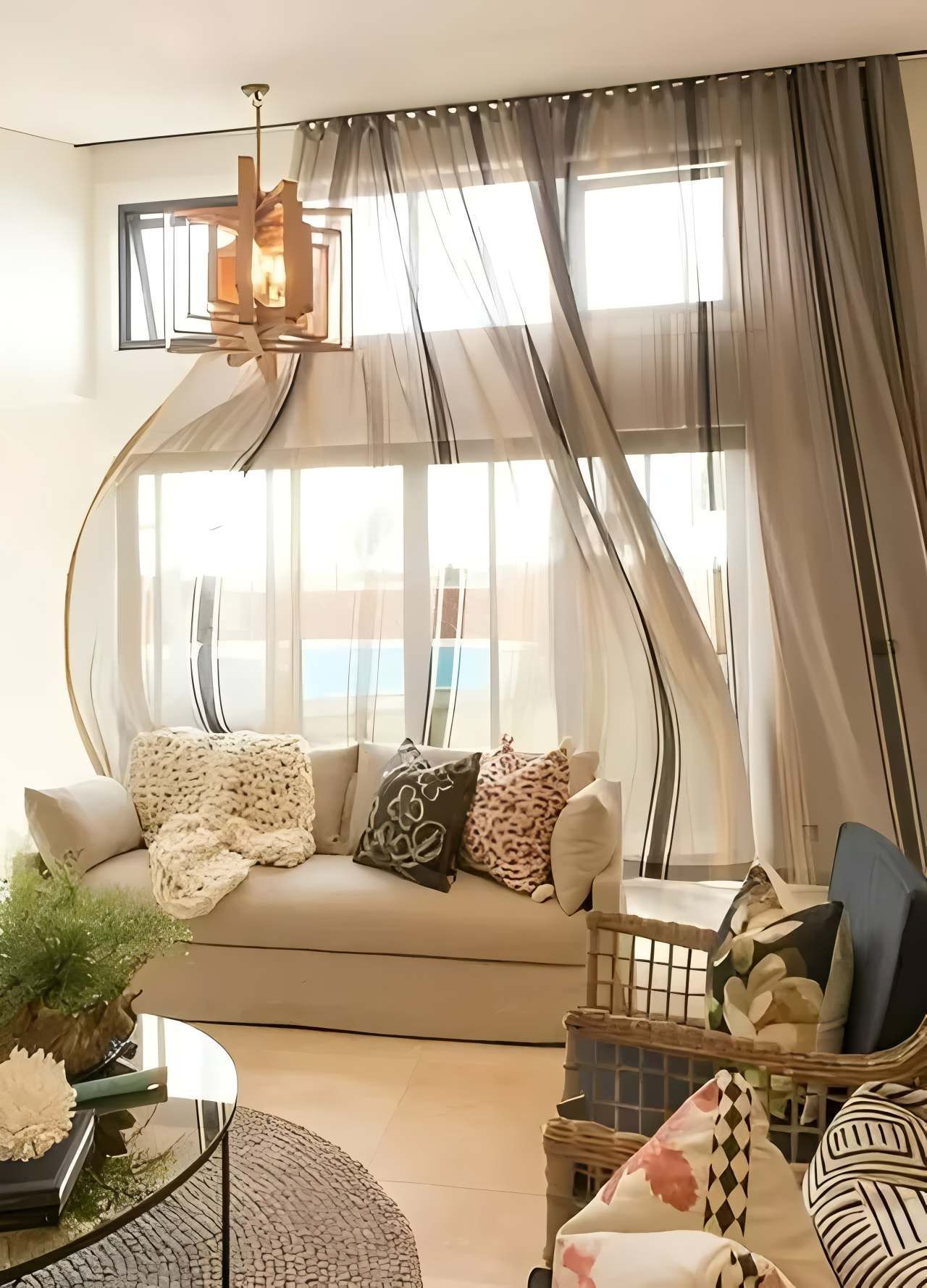 Living Room with Tan Sofa, Sheer Curtains Blowing in Front of Windows — JSF Interiors Goulburn in Goulburn, NSW