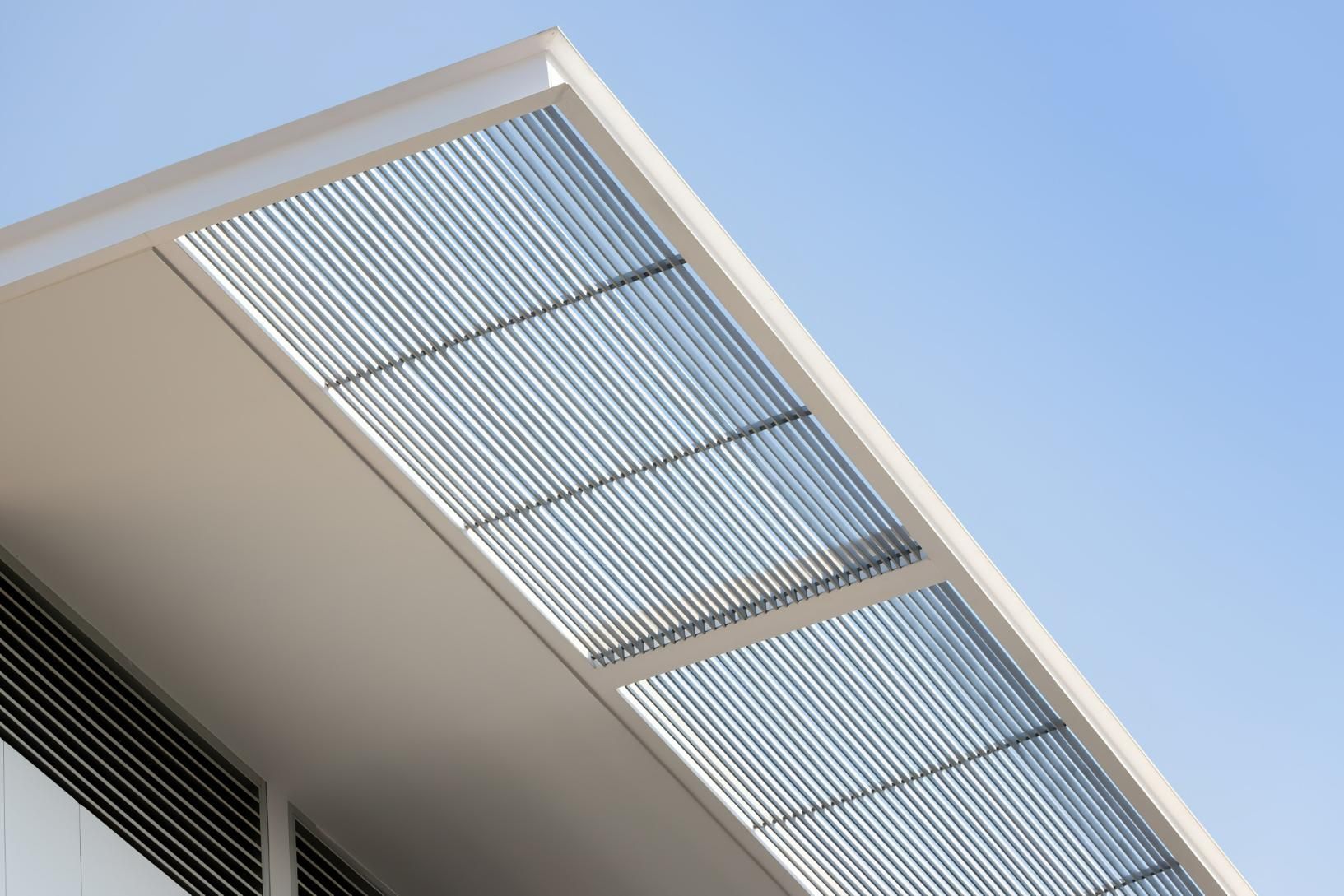 White Building Roof With Corrugated Metal Shading Panel — JSF Interiors Goulburn in Goulburn, NSW