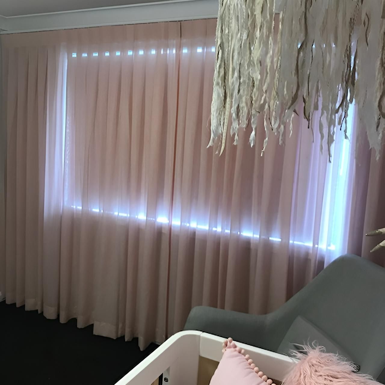Pink Sheer Curtains Frame a Window with Light Shining Through — JSF Interiors Goulburn in Moss Vale, NSW