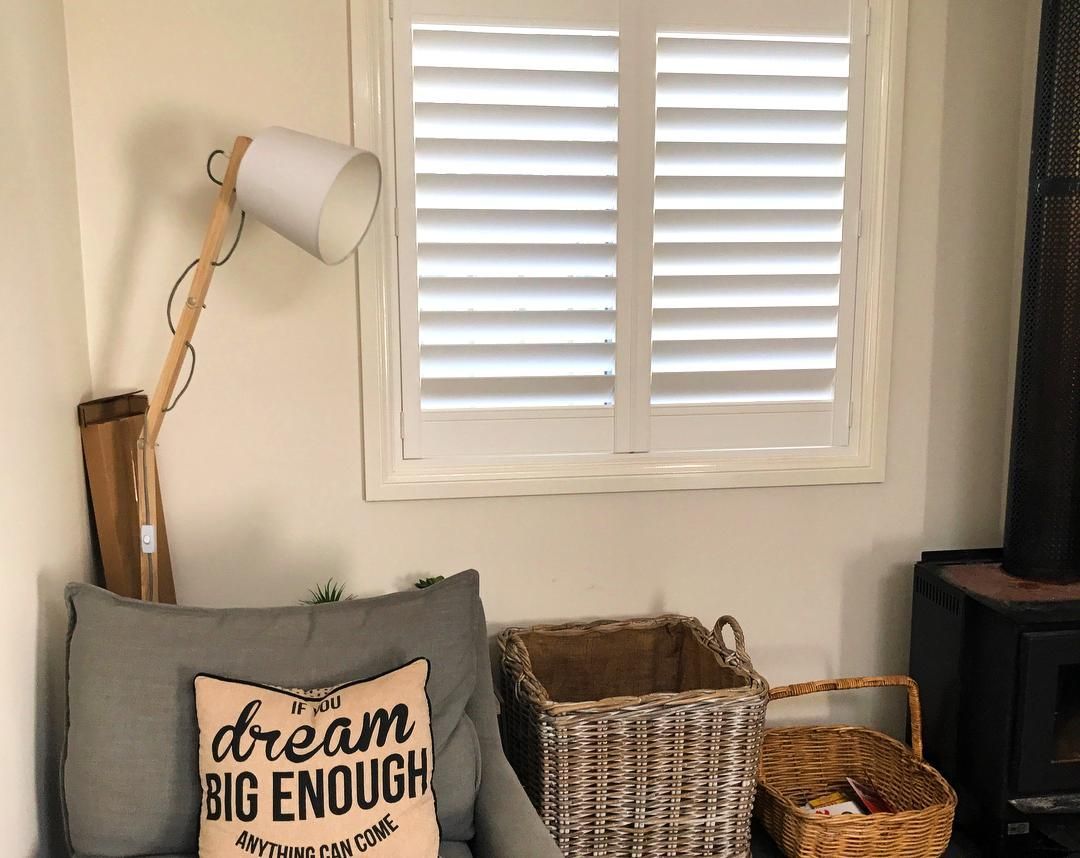 Cozy Corner With White Shutters And Armchair — JSF Interiors Goulburn in Mittagong, NSW