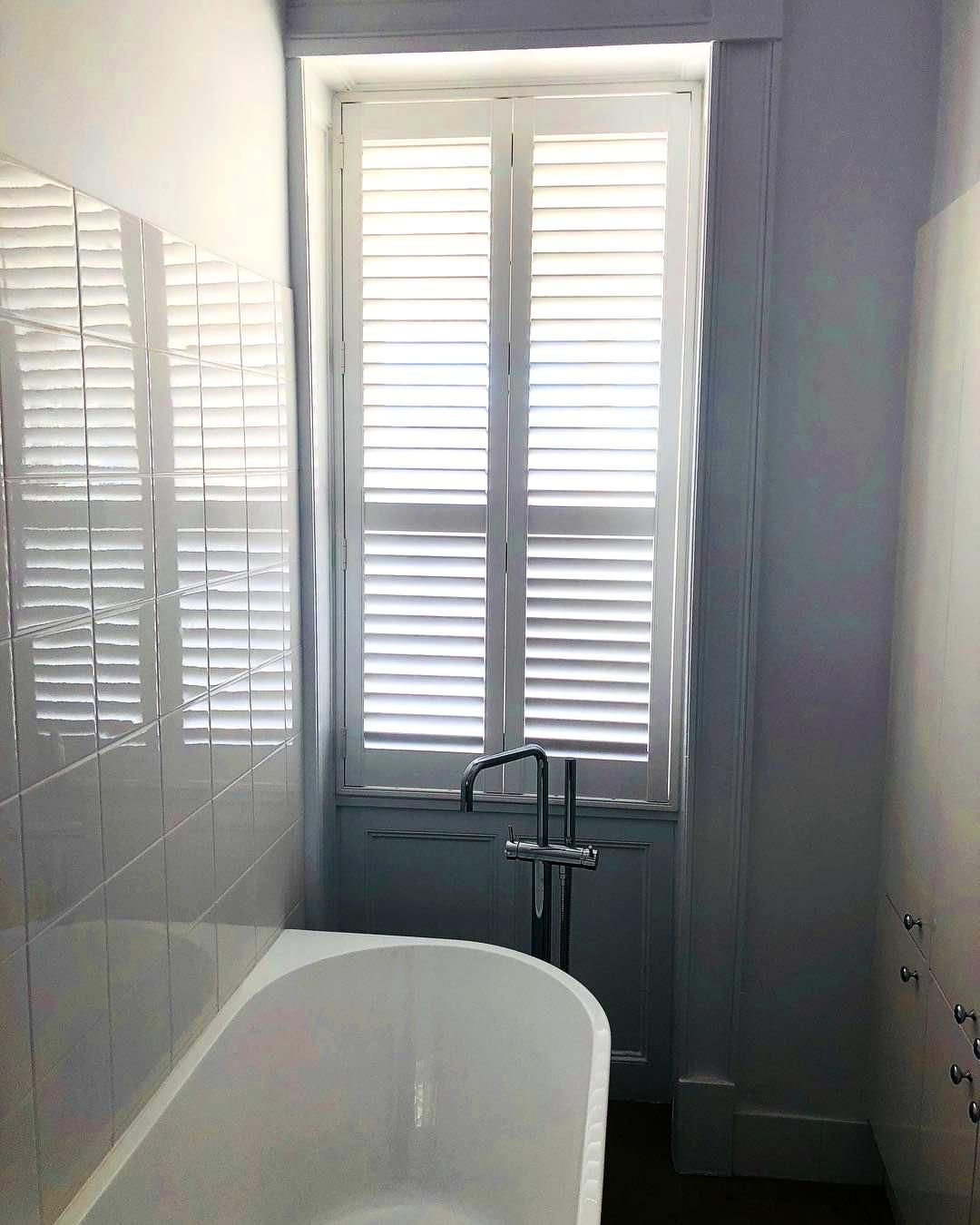 Bathroom With White Tub And Shutters — JSF Interiors Goulburn in Mittagong, NSW