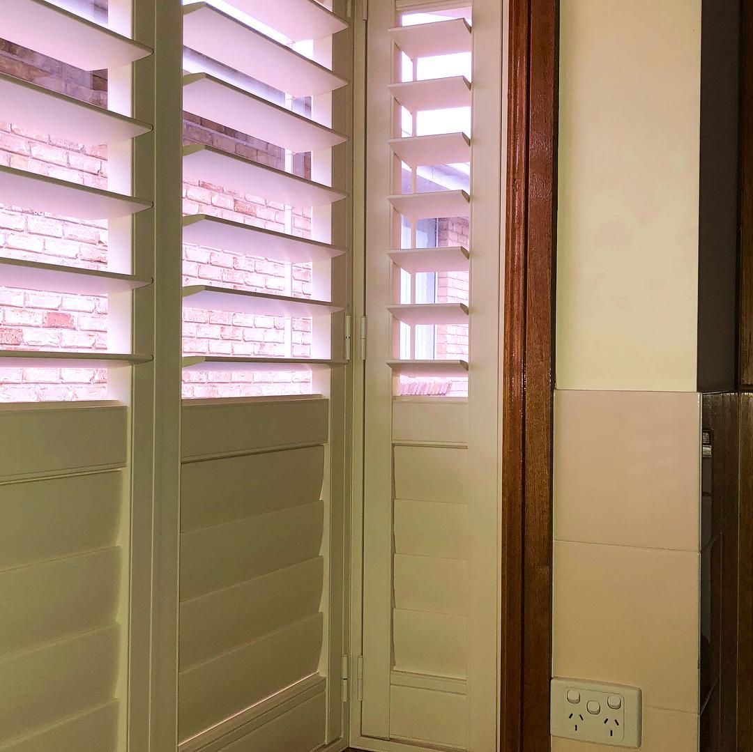 White Window Shutters Casting Shadows — JSF Interiors Goulburn in Dapto, NSW